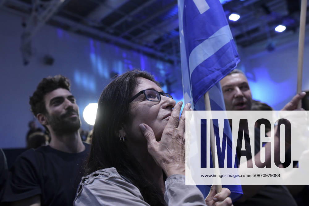 Yashar Supporters Celebrate Exit Polls A woman holds a Yashar flagpole and calls out with her hand near her mouth while other supporters watch and cheer in Tel Aviv, Israel, on October 27, 2026. Supporters of Yashar, the party led by former Israeli military chief Gadi Eisenkot, gathered in Tel Aviv as initial exit polls were released following voting in the 26th Knesset election. Tel Aviv Tel Aviv Israel