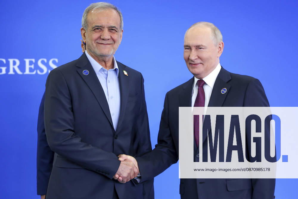 Moscow, Russian Federation: Russian President Vladimir Putin shakes hands with Iranian President Masoud Pezeshkian, left, during the official welcoming ceremony for the heads of delegations participating in the 8th summit of the Gas Exporting Countries Forum, October 27, 2026 in Moscow, Russia. Moscow Russian Federation - ZUMAp138 20261027_zaa_p138_008