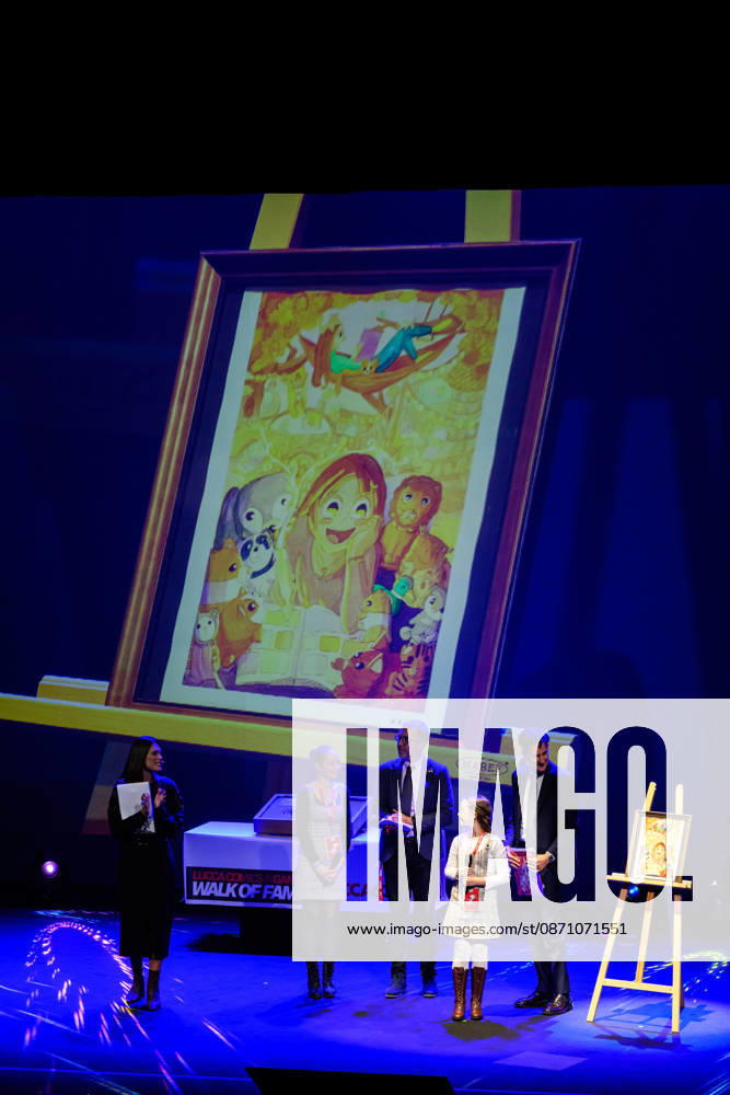 The variant cover of the poster created by the young talent Louise Sto phant (winner of the Petit Fauve in Angouloªme) is unveiled on the theatre stage during the inauguration of the 60th edition of Lucca Comics & Games, Lucca, 28 10 2026 Lucca Italy - ZUMAa289 20261028_zia_a289_105