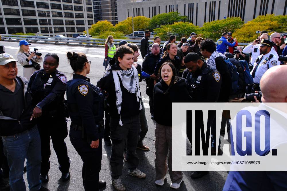 NEW YORK, NY- OCTOBER 28: 13 activists were arrested on the Brooklyn Bridge to demand I.C.E stop shooting New Yorkers on October 28, 2026 in New York City.