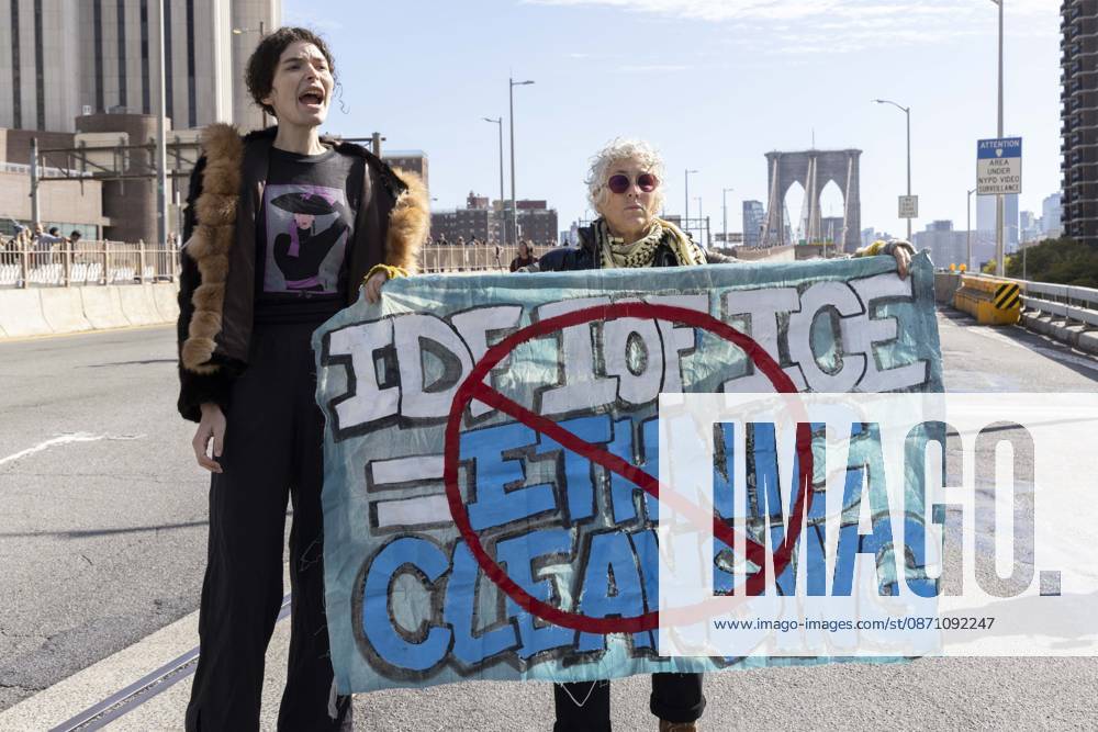 Anti-ICE (U.S. Immigration and Customs Enforcement) demonstrators blockade the roadway on the Brooklyn Bridge with a banner that reads red circle slash IDF IOF ICE equals ETHNIC CLEANSING protesting the continued detainment of O. Belgal, who was shot by federal agents in the Bronx with his 5-yr-old son in the car. The demonstration stopped Brooklyn bound traffic and results in arrests by NYPD. Protesters call for ICE out of New York. New York USA - ZUMAr174 20261028_znp_r174_005