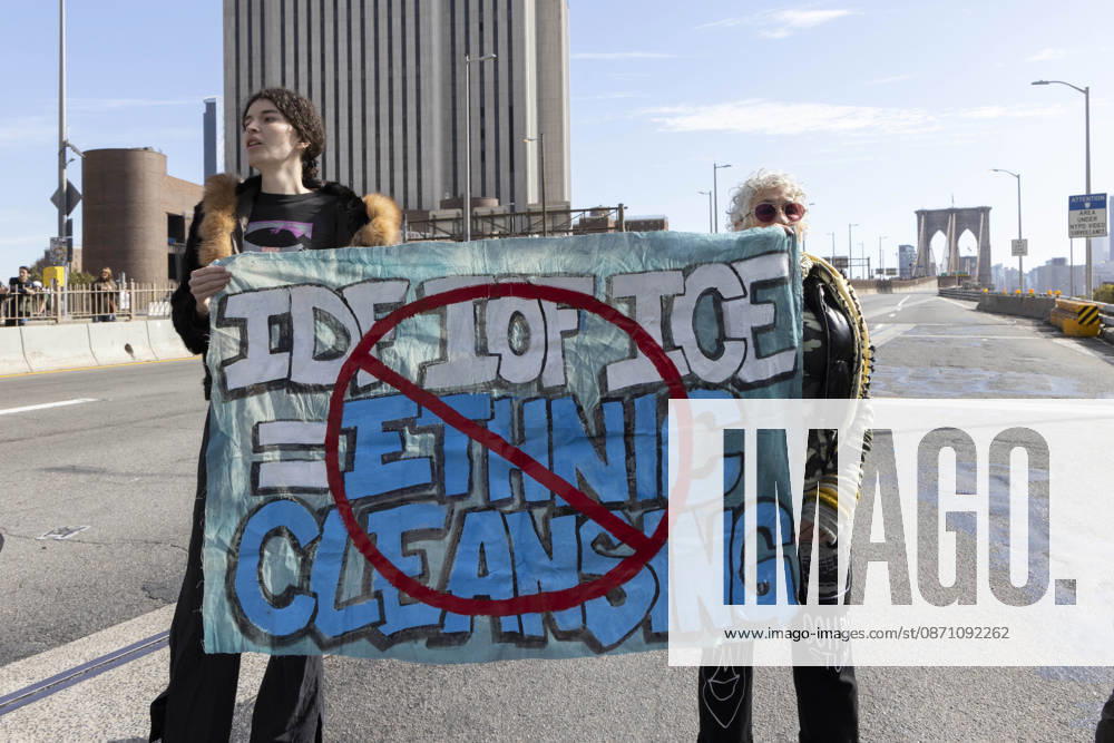 Anti-ICE (U.S. Immigration and Customs Enforcement) demonstrators blockade the roadway on the Brooklyn Bridge with a banner that reads red circle slash IDF IOF ICE equals ETHNIC CLEANSING protesting the continued detainment of O. Belgal, who was shot by federal agents in the Bronx with his 5-yr-old son in the car. The demonstration stopped Brooklyn bound traffic and results in arrests by NYPD. Protesters call for ICE out of New York. New York USA - ZUMAr174 20261028_znp_r174_010