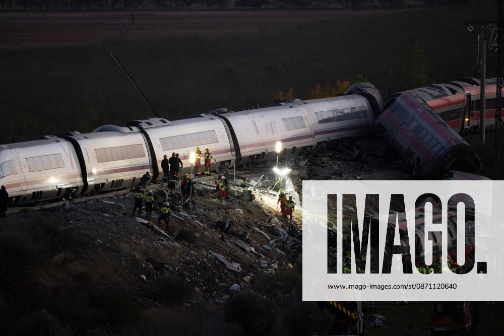 Rescue workers at the deadly train colllision scene as night falls. At least 68 people have died and dozens more were injured after two high-speed passenger trains collided near Urda station in the province of Toledo at 08:53am when a state-owned Renfe AVE train struck the rear of a stationary train operated by private carrier Iryo. More than 500 passengers were on board both trains, which were traveling along the Madrid-Andalusia high-speed corridor. Spanish Transport Minister Puente stated that the collision followed a safety system failure. Urda Spain - ZUMAd308 20261028_zsp_d308_164