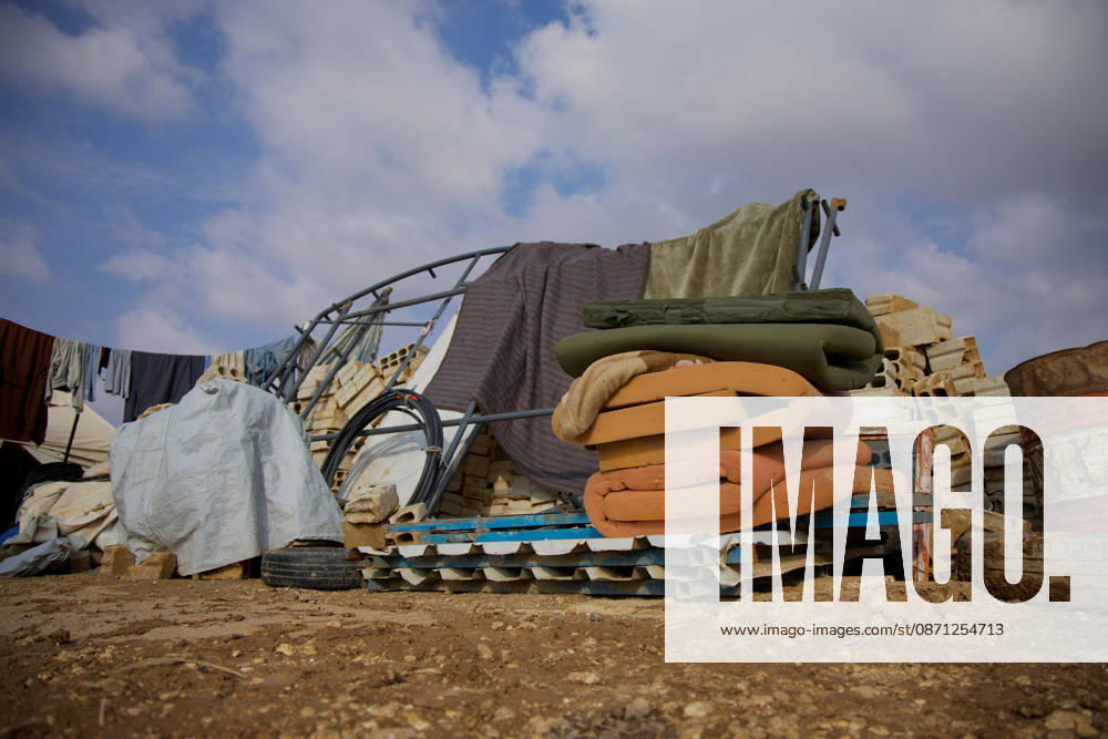 Flooding Damages Al-Talai Displacement Camp Rolled mattresses and bedding are stacked on pallets beside a twisted metal shelter frame at Al-Tala i camp in Al-Hasakah, Syria, on October 29, 2026. Heavy rain on October 28-29 flooded tents at Al-Tala i, also known as Serekaniye camp, which shelters families displaced from Ras al-Ain, damaging bedding and belongings and prompting calls for humanitarian assistance. Al Ḩasakah Al-Hasakah Syria