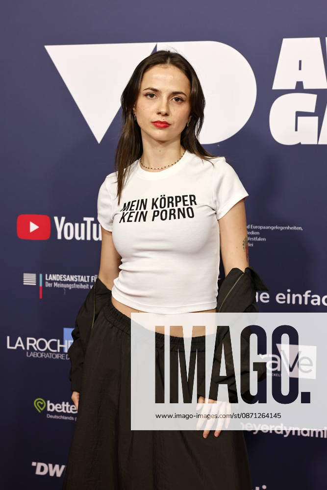 Activist Theresia Crones is making a statement against digital violence—wearing a T-shirt that reads My Body, Not Porn at the 2025 VideoDays Festival Awards ceremony at the E Werk. The law student discovered fake pornographic images of herself online when she was 21