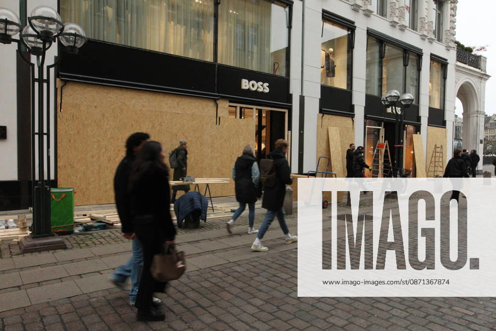 Hugo Boss store on Neuer Wall. The store s windows were barricaded with wooden panels out of fear of vandalism during Saturday s Gen Z demonstration in downtown Hamburg. Hamburg s Old Town