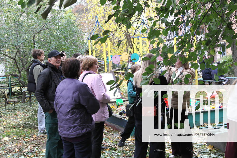 People stay at a playground outside an apartment block on Oleksandra Polia Avenue damaged by a Russian drone strike in Dnipro, Ukraine, on October 30, 2026. The Russian attack damaged at least five residential high-rise buildings and a school. More than 300 windows were shattered in the strike. (Photo by Mykola Miakshykov Ukrinform) Russian attack damages residential buildings and school in Dnipro
