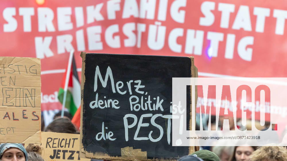 Gen Z Takes Charge: Hundreds March Through the Old Town and Südstadt, Nuremberg, October 31, 2026 Participants in the Gen Z Takes Charge initiative hold up protest signs and a red banner reading Ready to Strike, Not Ready for War during a demonstration. The natio 20261031-1V9A3903-M4000