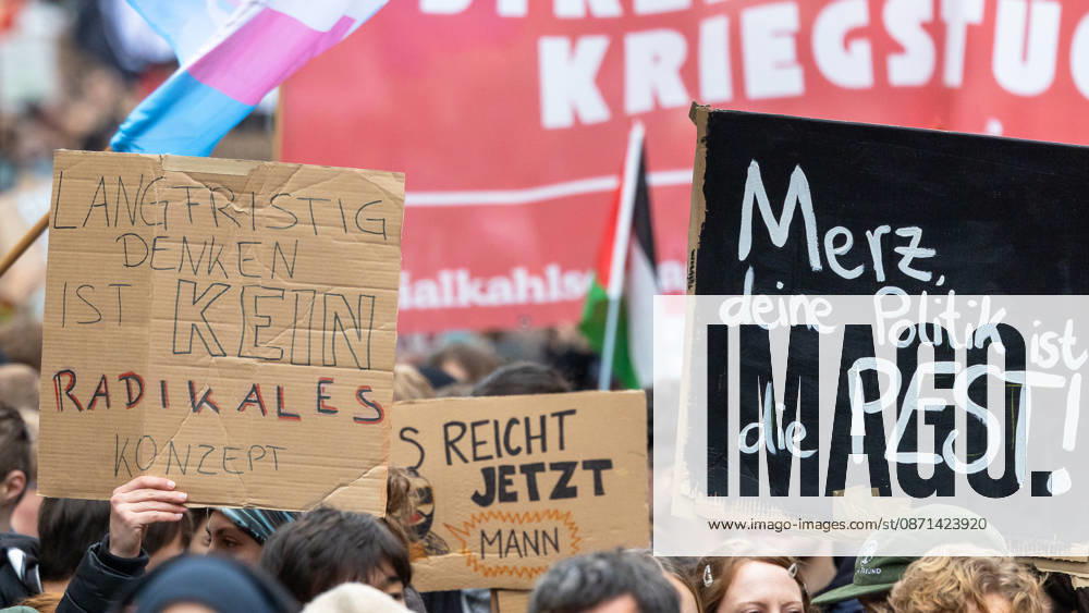 Gen Z Takes Charge: Hundreds March Through the Old Town and Südstadt, Nuremberg, October 31, 2026. Participants in the Gen Z Takes Charge initiative hold up hand-painted cardboard signs during a demonstration, including Thinking long 20261031-1V9A3904-M4000