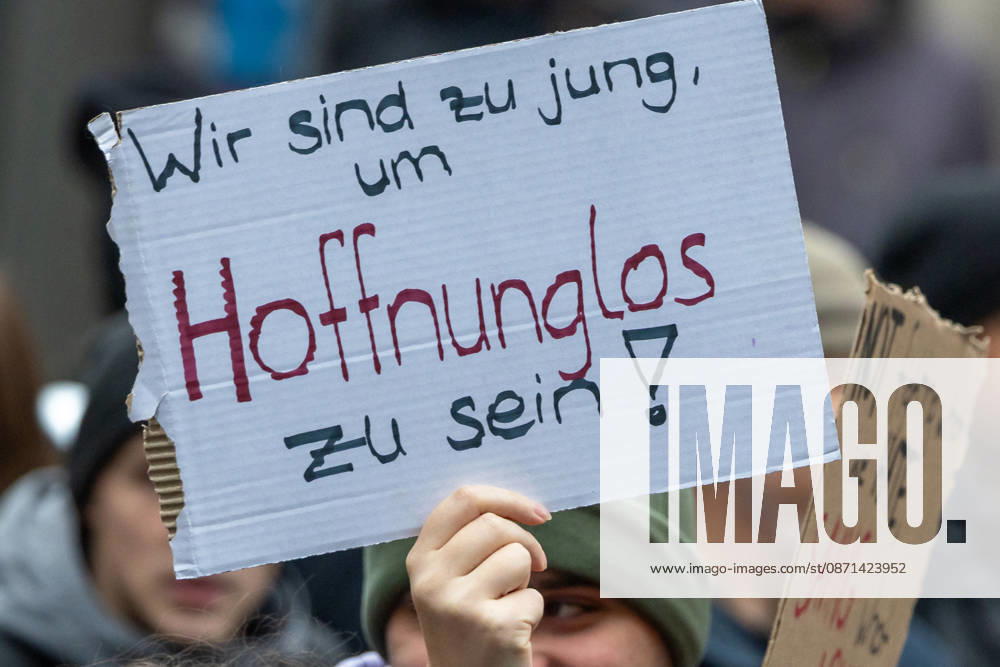 Gen Z Takes Charge: Hundreds March Through the Old Town and Südstadt, Nuremberg, October 31, 2026 During a protest march organized by the Gen Z Regelt initiative, a participant holds up a cardboard sign reading We’re too young to be hopeless. The nationwide initiative is c 20261031-1V9A3925-M4000