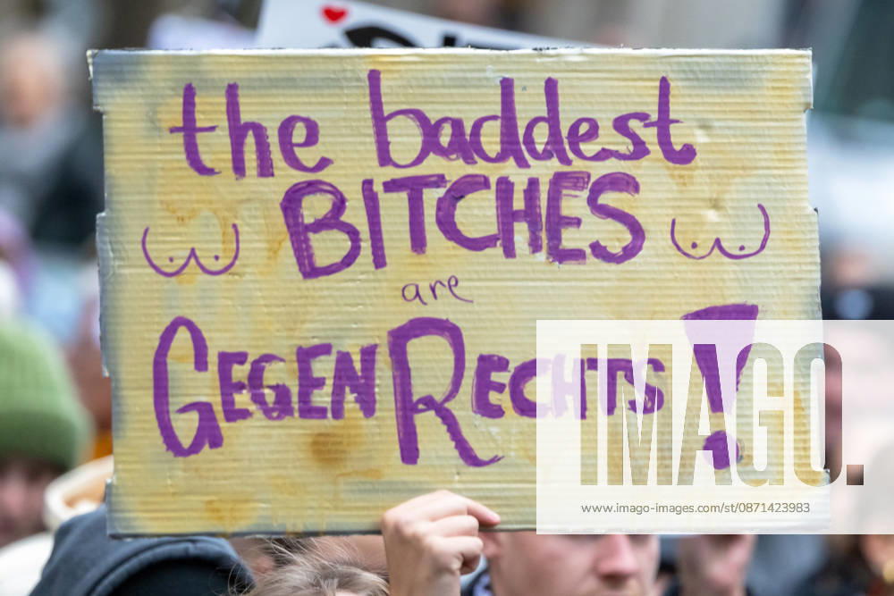 Gen Z Takes Charge: Hundreds March Through the Old Town and Südstadt, Nuremberg, October 31, 2026 A participant in the Gen Z Takes Charge initiative holds up a cardboard sign at the demonstration reading The Baddest Bitches Are Against the Right. The nationwide initiative calls for mo 20261031-1V9A3950-M4000