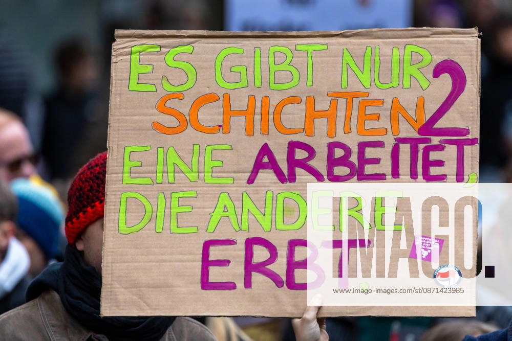Gen Z Takes Charge: Hundreds March Through the Old Town and Südstadt, Nuremberg, October 31, 2026 A demonstrator holds up a hand-painted cardboard sign reading There are only two classes: one works, the other inherits at a rally organized by the Gen Z Regelt initiative. The initiative is calling 20261031-1V9A3962-M4000