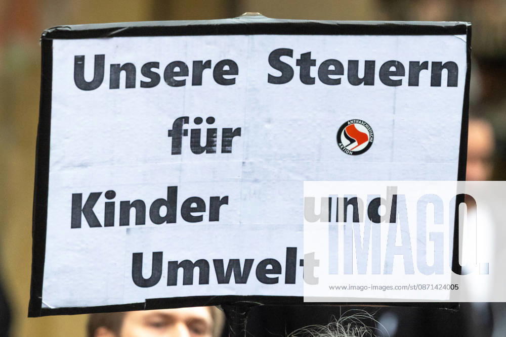 Gen Z Regels: Hundreds March Through the Old Town and Südstadt, Nuremberg, October 31, 2026. During a protest organized by the Gen Z Regels initiative, a demonstrator holds up a sign reading Our Taxes for Children and the Environment. The nationwide initiative is calling for more funding for 20261031-1V9A3965-M4000