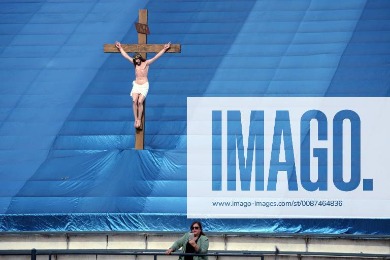 Los Angeles, California, United States - A woman and a statue of Jesus Christ are seen as during the 87th Annual Procession in honor of Our Lady of Guadalupe in Los Angeles, California on December 9, 2018. The Catholic procession is the oldest religious procession in Los Angeles and celebrates the apparition of the Virgin Mary in Mexico in 1531. Los Angeles United States - ZUMAn230 20181209_zaa_n230_551