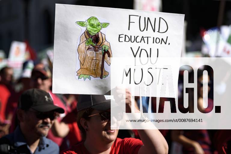 Los Angeles, California, United States - Teachers and supporters of public education march against education funding cuts during the March for Public Education in Los Angeles, California on December 15, 2018. The rally, organized by United Teachers Los Angeles, drew thousands of educators who demanded wage increases and smaller class sizes. Los Angeles United States - ZUMAn230 20181215_zaa_n230_883