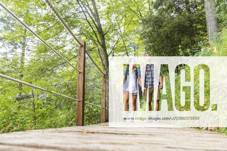 Italy, Massa, young couple hiking and walking on a boardwalk in the Alpi Apuane model released Symbolfoto WPEF00881