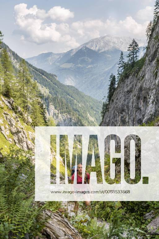 Hiker on a hiking trail View of mountains Saugasse Hiking trail to Königssee and Kärlinger Haus National Park Berchtesgaden Bavaria Germany Europe