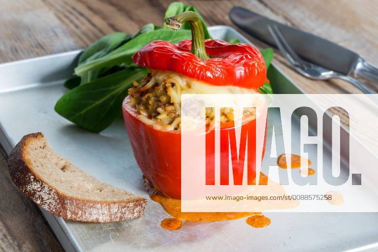 Baked stuffed peppers with meat sauce and cheese