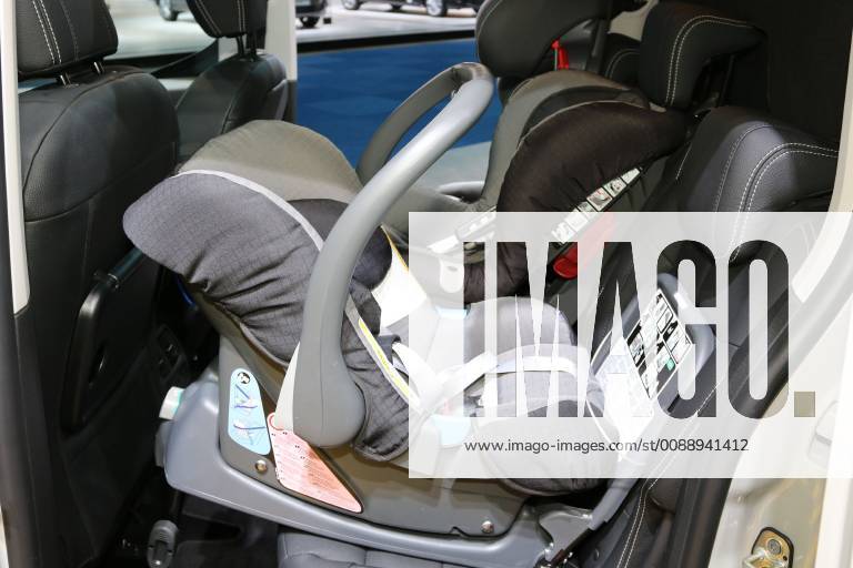 Backward facing child seat baby seat class 0 car child seat on the back seat of the Opel Combo Auto passenger car
