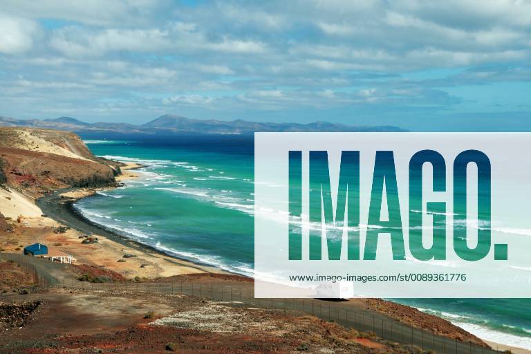 Fuerteventura view of the beach of Mal Nombre the turquoise blue sea and a camper Spain