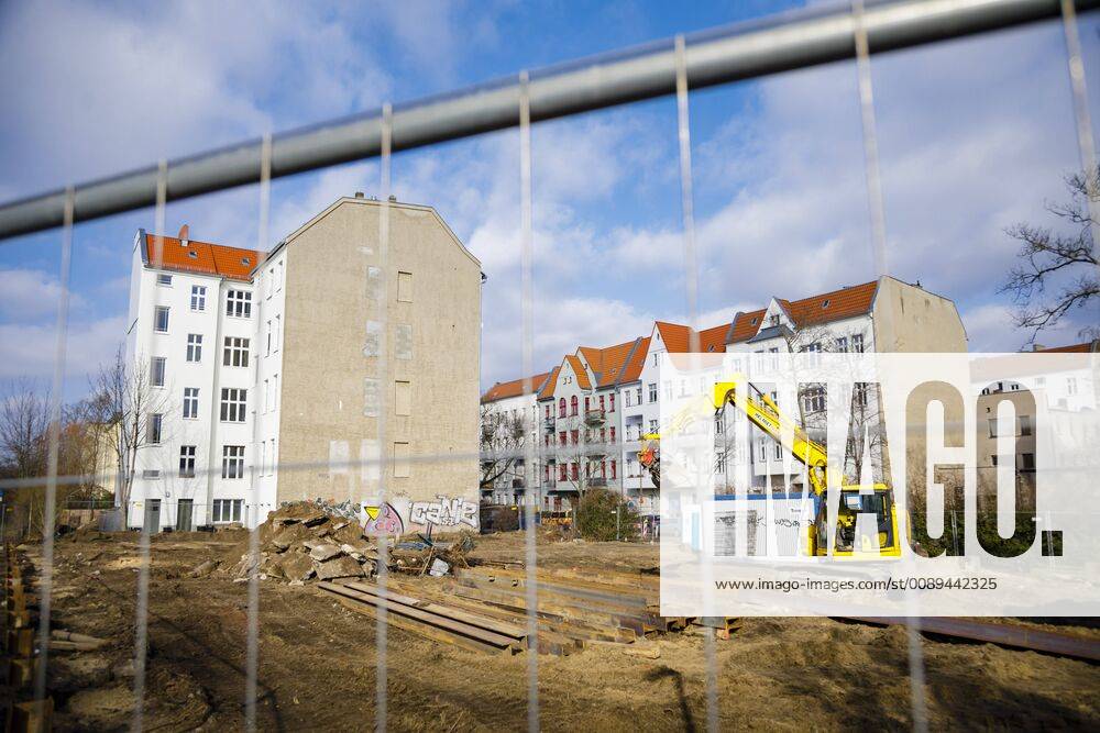 A new residential building is being built next to an old building Berlin 14 02 2019 Berlin Germany