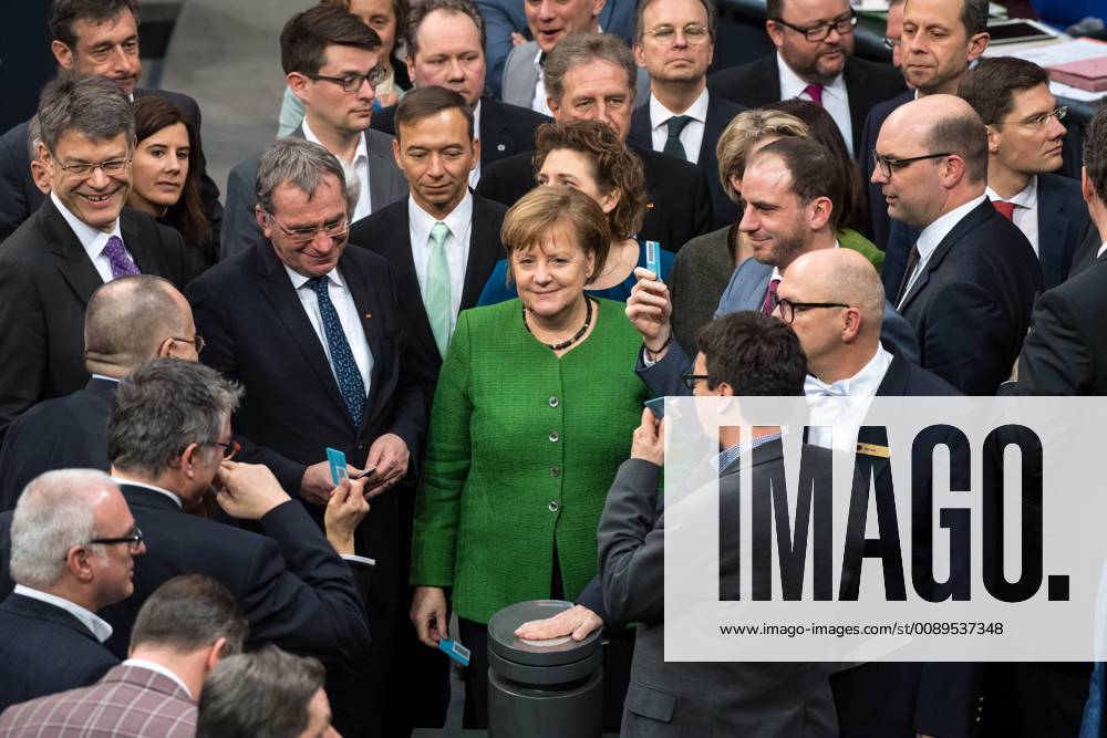 Politics Bundestag Session of the German Bundestag on Thursday 21 February 2019 In the picture The members of parliament vote by name on the amendment of the Basic Law to introduce the so-called digital pact With a green suit jacket Chancellor Angela Merkel CDU 21 2 2019 Berlin