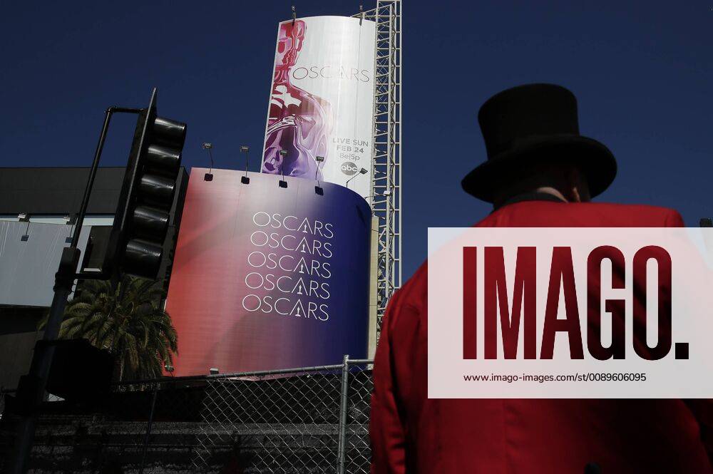 A man in a Top Hat hands out brochures near the Dolby Theater as preparations continue for the 91st Academy Awards in the Hollywood section of Los Angeles on February 23, 2019. Oscar winners will be announced during an ABC live telecast on February 24th. LAP201902239010 JOHNxANGELILLO