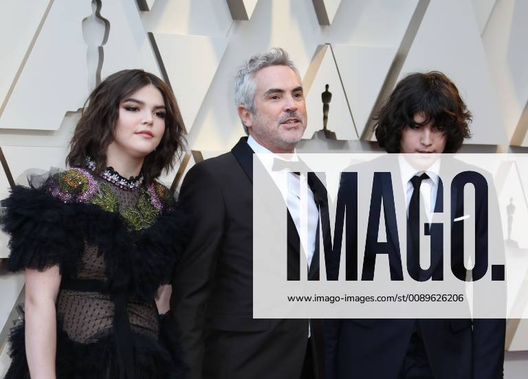 Mexican director Alfonso Cuaron (C) and his children Olmo Teodoro (R) and Tess Bu (L) arrive at the red carpet of the 91th Academy Awards, in Hollywood, California, United States, 24 February 2019. 91st Academy Awards in Hollywood !ACHTUNG: NUR REDAKTIONELLE NUTZUNG!