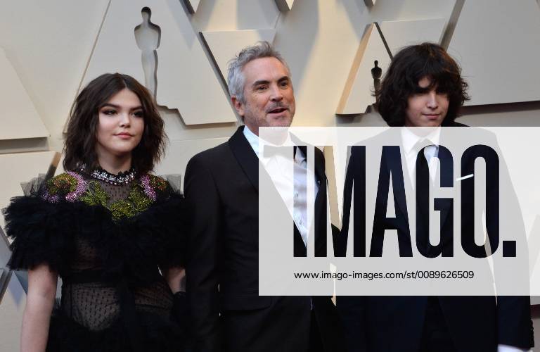 Alfonso Cuarón (C) and guests arrive on the red carpet for the 91st annual Academy Awards at the Dolby Theatre in the Hollywood section of Los Angeles on February 24, 2019. LAP20190224246 JIMxRUYMEN