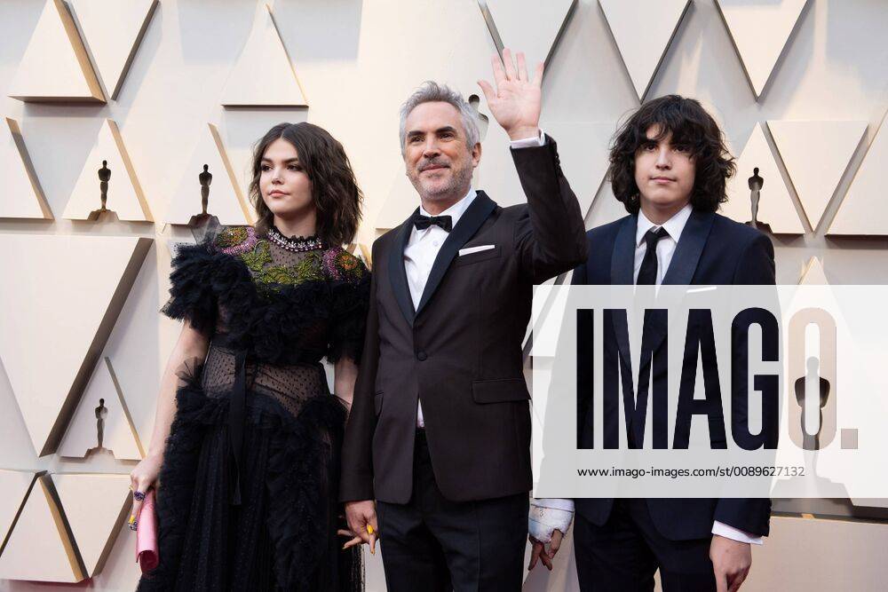 Guest, Oscar nominee Alfonso Cuaron, and guest arrive on the red carpet of The 91st Oscars at the Dolby® Theatre in Hollywood, CA on Sunday