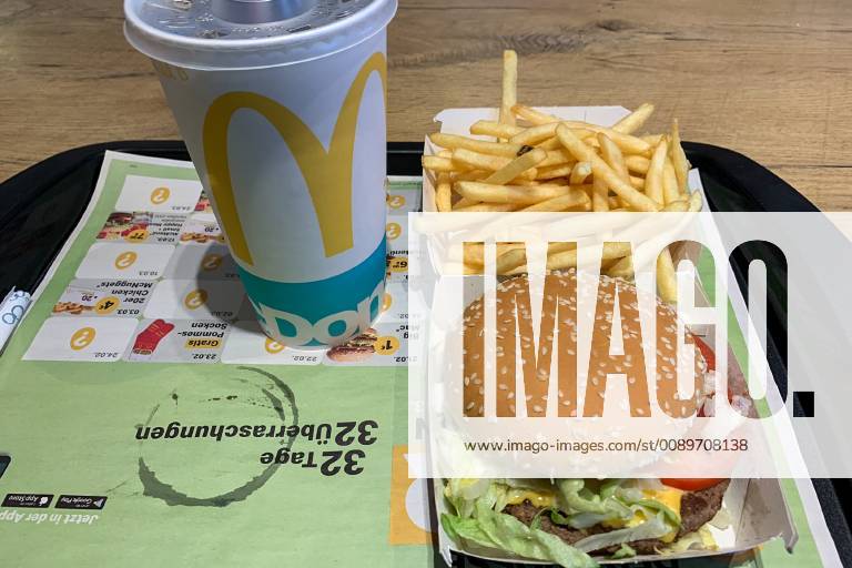 Classic Menu Mc Donald Food A Hamburger Royal TS with a portion of French fries and a soft drink