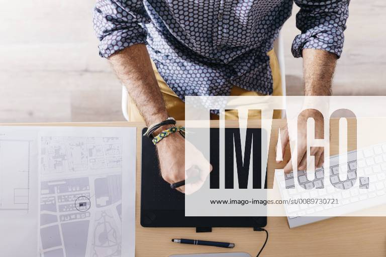 Close-up of man working at home using graphics tablet model released Symbolfoto property released JRFF02172