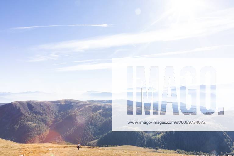 Italy, South Tyrol, Dolomites, Hafling, female hiker on dried mountain meadow in late summer model released Symbolfoto MMAF00730