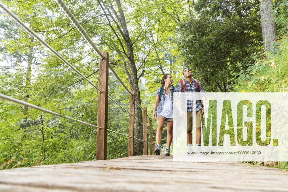 Italy, Massa, young couple hiking and walking on a boardwalk in the Alpi Apuane model released Symbolfoto WPEF00881