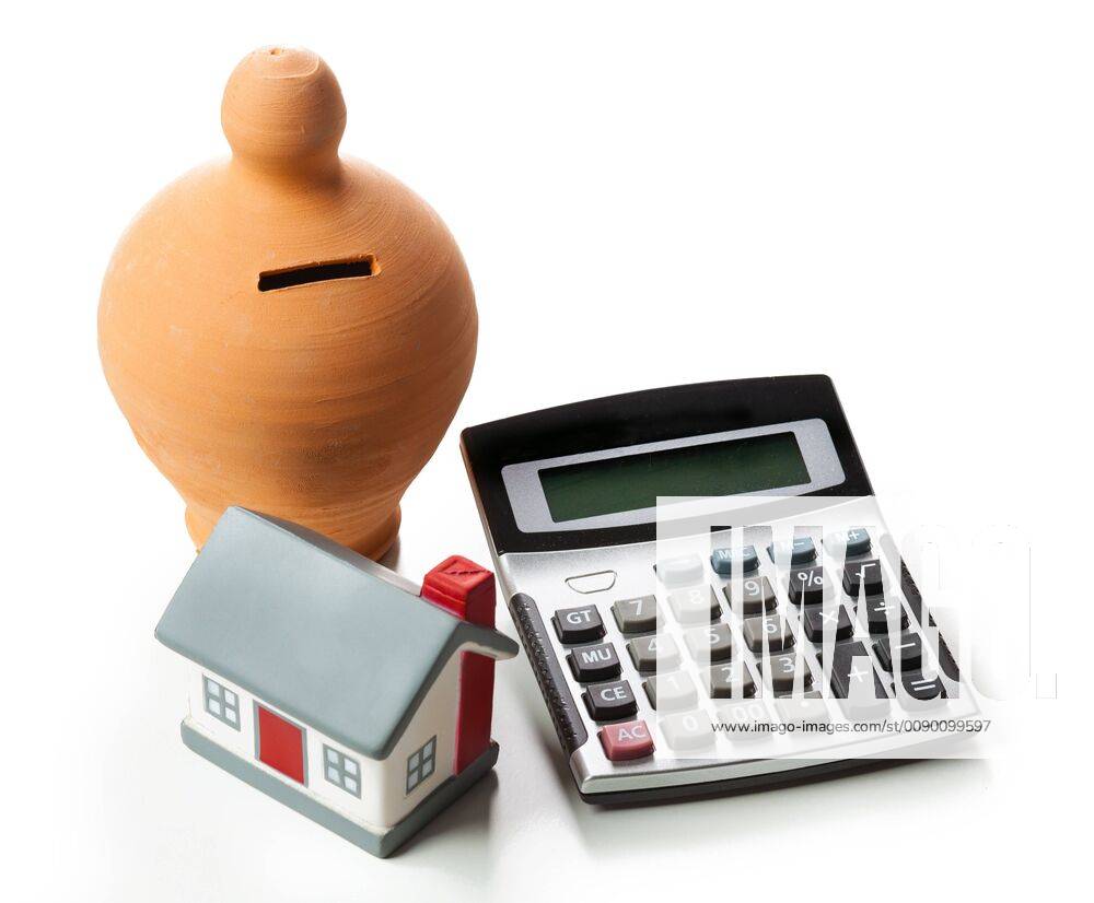 The concept of financial savings to buy a house Money box and calculator isolated on white background 1085306935