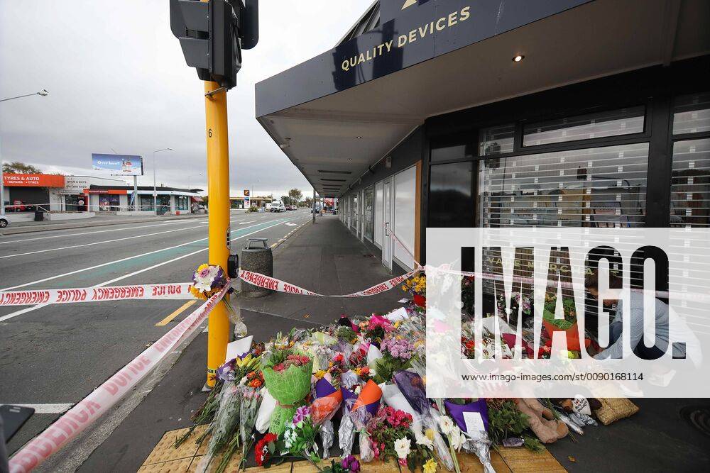 Christchurch, New Zealand - A woman places flowers to victims of the mosque attacks outside the Linwood Masjid mosque in Christchurch on March 16, 2019. At least 49 people dead and more than 40 people injured following attacks on two mosques in Christchurch. The national security threat level has been increased from low to high for the first time in New Zealand s history after this attack. Christchurch New Zealand - ZUMAn230 20190317_zaa_n230_001