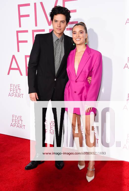Cole Sprouse and Haley Lu Richardson arriving at the premiere of Five Feet Apart in Los Angeles, California - March 7, 2019 - Los Angeles Premiere of Five Feet Apart, Los Angeles California United States Fox Bruin Theatre