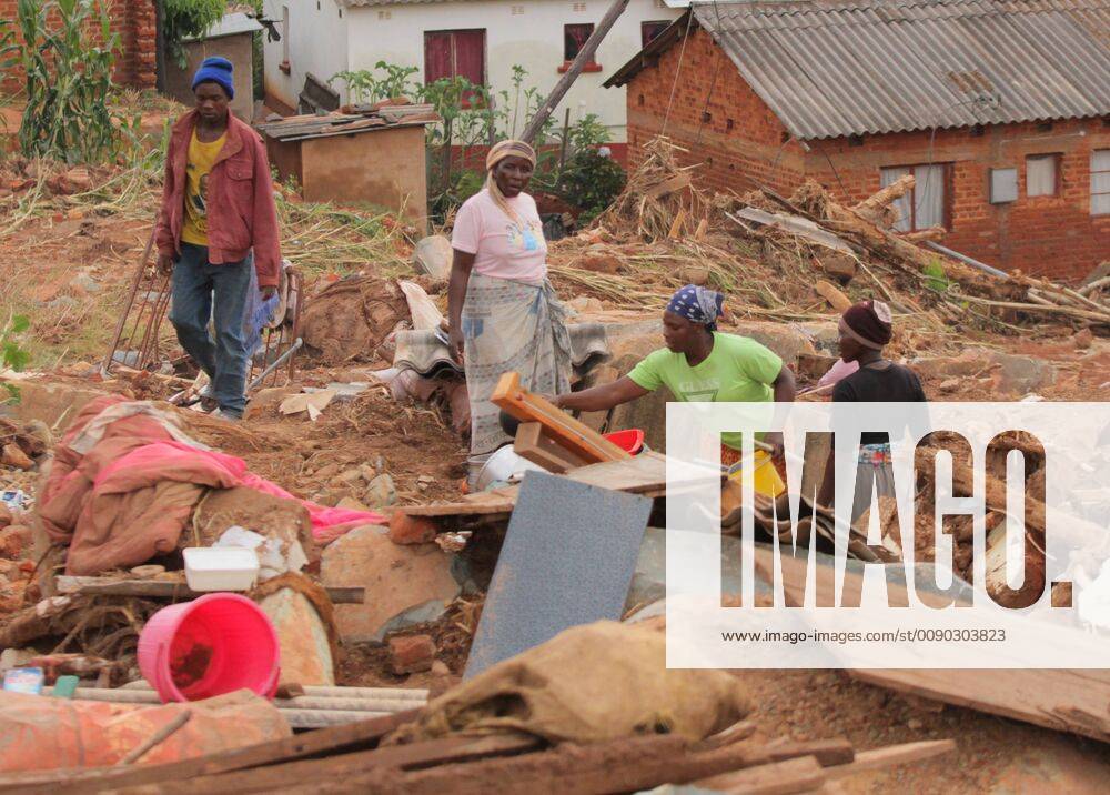 (190323) -- MANICALAND (ZIMBABWE), March 23, 2019 -- Villagers salvage items from debris in a village ravaged by Cyclone Idai in Chimanimani, Manicaland Province, Zimbabwe, March 23, 2019. Zimbabwe began two days of national mourning on Saturday in remembrance of the victims of Cyclone Idai which induced floods ravaging the eastern and southern parts of the country last weekend. The Civil Protection Unit said that as of Friday night, the death toll from Idai in Zimbabwe had risen to 154 with 187 still missing. A total of 162 people were injured while 136 were marooned. ) ZIMBABWE-MANICALAND-CHIMANIMANI-CYCLONE IDAI ShaunxJusa
