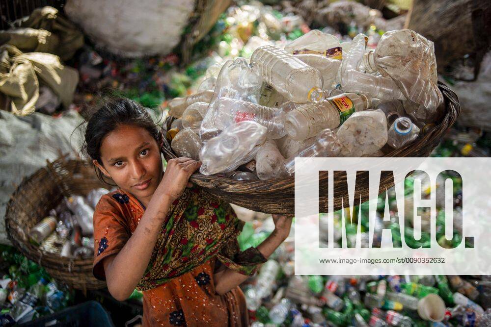 Dhaka, Dhaka, Bangladesh - An under-age girl seen working at a plastic bottle recycling factory..Women and under-age worker or child labour still work in many plastic bottle recycling factories. Most of the factories do not maintain any proper working conditions for any of its labourers. Dhaka Bangladesh - ZUMAs197 20190327_zab_s197_099