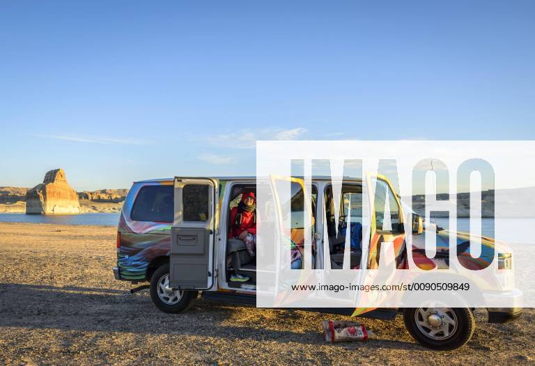 Campingvan Camper at the sandy beach at Lake Powell Lone Rock Beach Campground Glen Canyon National Recreation Area Page Utah USA North America