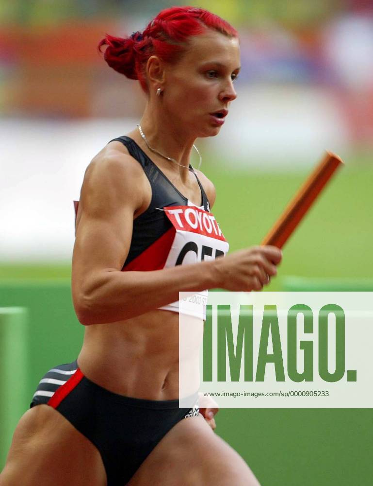 Claudia Hoffmann (Deutschland) mit dem Staffelstab Leichtathletik WM Damen Weltmeisterschaft 2003, Nationaltrikot, 4x400m, 4 x 400 m, 400m, Meter, Staffel, Staffellauf, Vdig Einzelbild Paris Dynamik,