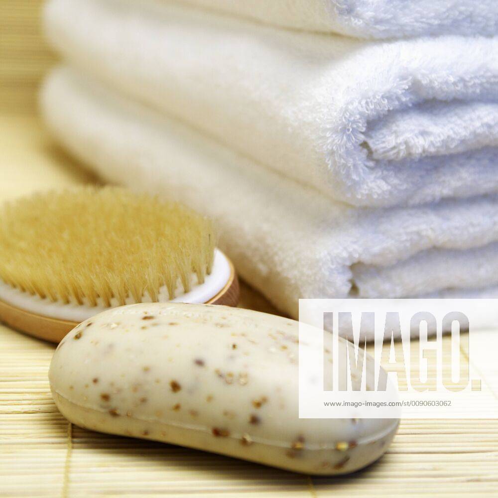 Close up of oatmeal soap, brush and towels Close up of oatmeal soap, brush and towels,Bradenton, Florida, USA 46896