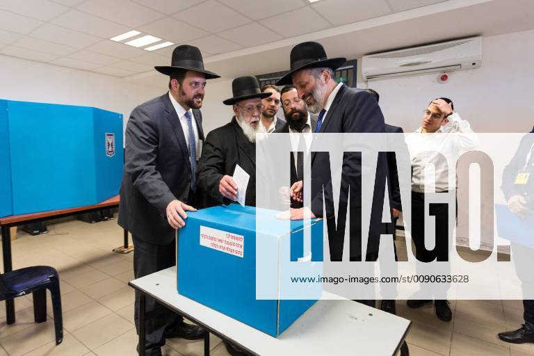 Jerusalem, Israel - Minister of the Interior of Israel, Aryel Deri (right) accompanies Shas leader Hakam Shalom Hakohen for voting in polling station in Ramot settlement in Jerusalem, Israel on April 9, 2019. Shas is the ultra-orthodox Jewish party, currently in coalition with Likud it is a part of government. Snap elections have been called for April 9, record 40 parties run for seats in Knesset. Jerusalem Israel - ZUMAn230 20190409_zaa_n230_145