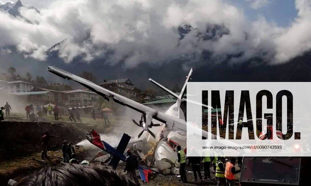(190414) -- SOLUKHUMBU, April 14, 2019 -- Photo taken on April 14, 2019 shows the site of aircraft collision at Lukla airport in Solukhumbu, Nepal. At least two people were killed after an aircraft of Summit Air collided with a helicopter at Lukla Airport in Nepal on Sunday morning, according to local authorities. NEPAL-SOLUKHUMBU-LUKLA AIRPORT-AIRCRAFT CRASH sunilxsharma