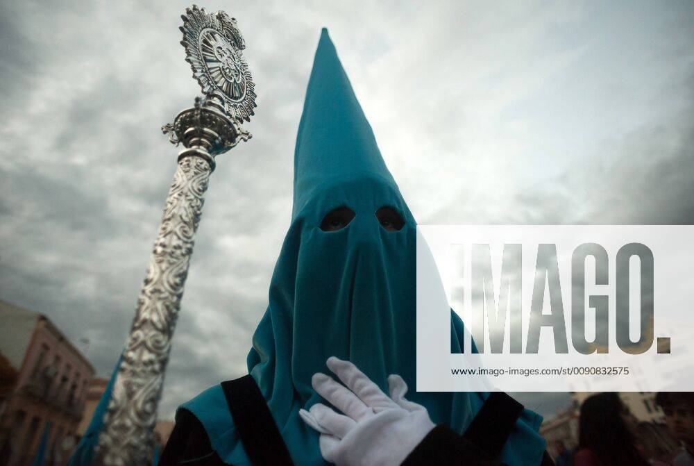 Malaga, MALAGA, Spain - A penitent of Traslado brotherhood is seen looking on as he takes part during the holy week procession..The Holy Week in Andalusia is one of the most important and famous religious feasts in Spain. Every year, thousands of Christian believers celebrate the Holy Week of Easter with the crucifixion and resurrection of Jesus Christ. Malaga Spain - ZUMAs197 20190419_zaa_s197_185