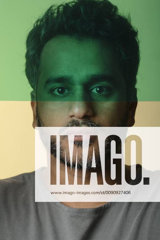 Portrait of an Indian man behind green glass layers model released Symbolfoto ALBF00794