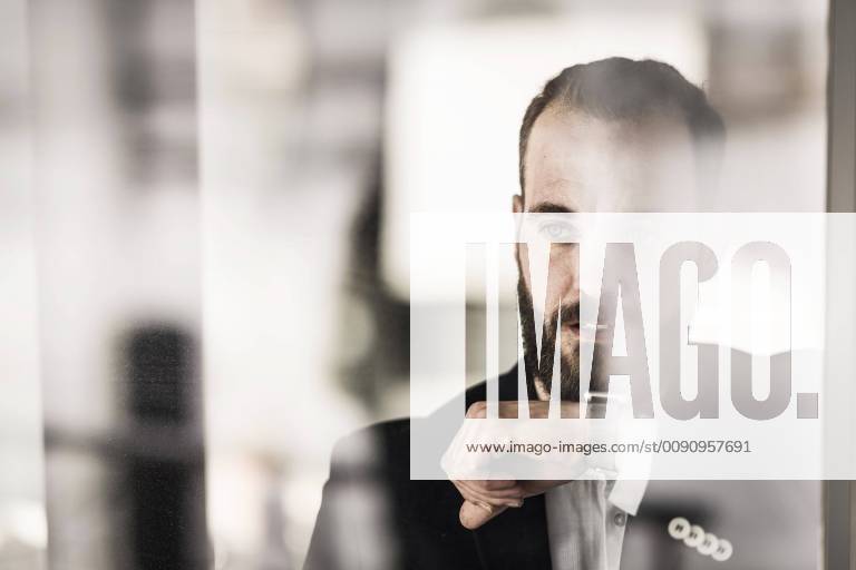 Businessman using smartwatch, portrait model released Symbolfoto property released MJRF00129