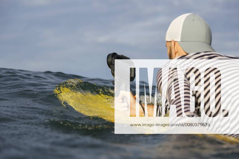 Indonesia, Bali, man with waterproof smartphone in the sea model released Symbolfoto KNTF02641