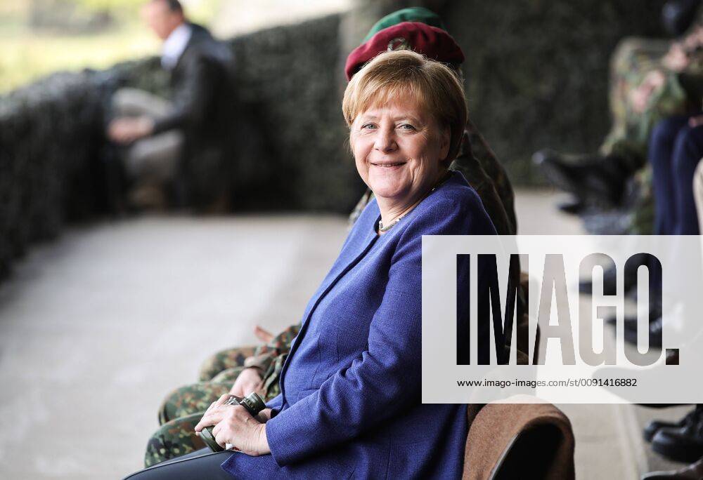 (190520) -- MUNSTER, May 20, 2019 (Xinhua) -- German Chancellor Angela Merkel prepares to watch a training demonstration during her visit to NATO s Very High Readiness Joint Task Force (VJTF) in Munster, Germany, on May 20, 2019. Merkel on Monday assured Germany s help for Ukraine to solve the conflicts in its Donbas region. She made the statement during her visit to a rapid reaction force of NATO in Germany s Munster. (Xinhua Shan Yuqi) GERMANY-MUNSTER-MERKEL-NATO-RAPID RESPONSE FORCE