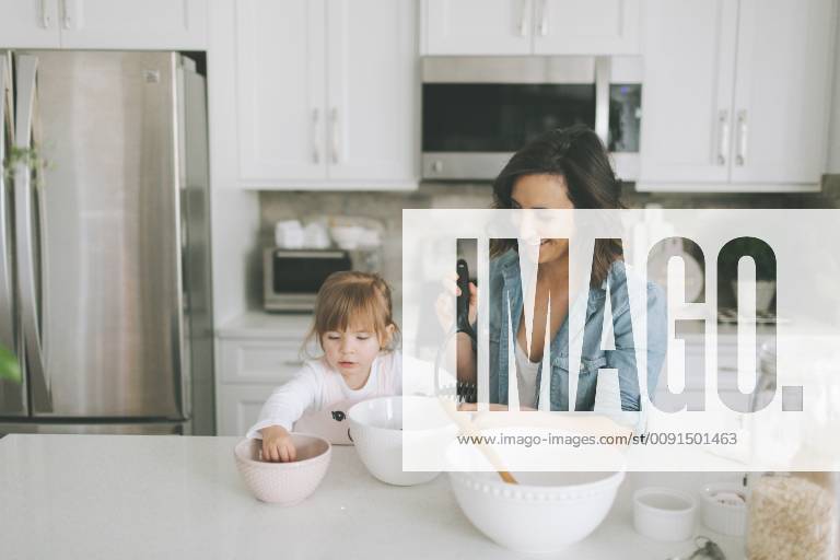 Mother and daughter making a cake together model released Symbolfoto property released CMSF00032